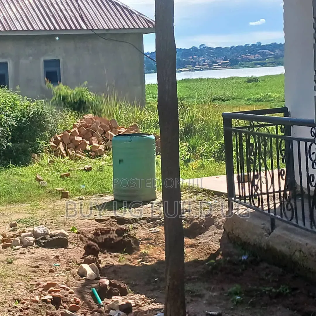 Lake View Plot With House on Quick Sale Garuga Ntebe 11decimals in Central Division
