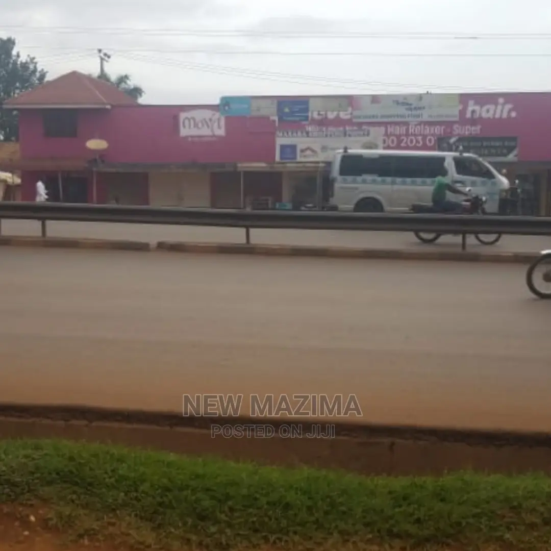 Busy Commercial Shops Measuring Direct on Tarmac of Ntebe Rd in Central Division