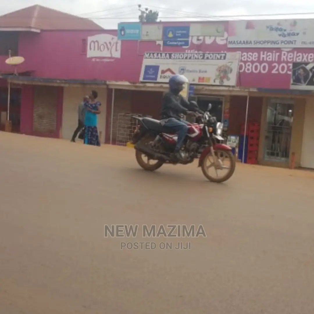 Busy Commercial Shops Measuring Direct on Tarmac of Ntebe Rd in Central Division