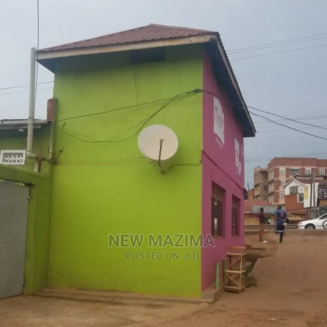Busy Commercial Shops Measuring Direct on Tarmac of Ntebe Rd in Central Division