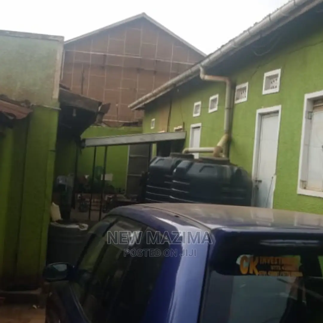 Busy Commercial Shops Measuring Direct on Tarmac of Ntebe Rd in Central Division