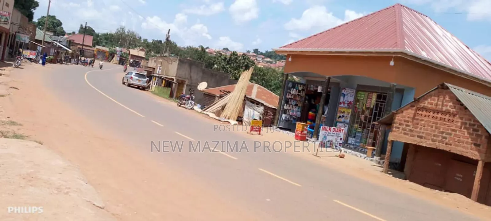 Very Busy Commercial Two Double Shops on Forced Sale Nansana Town in Central Division