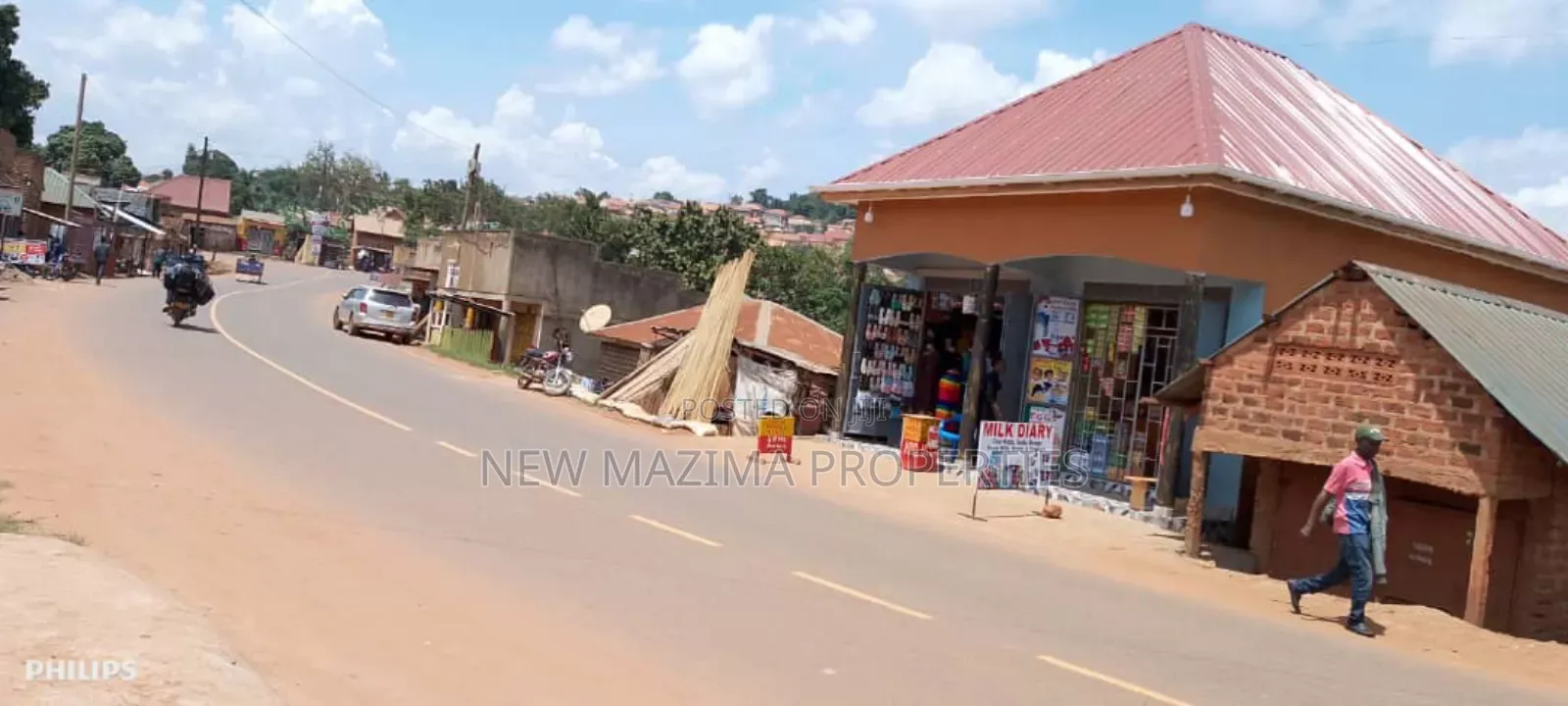 Very Busy Commercial Two Double Shops on Forced Sale Nansana Town in Central Division
