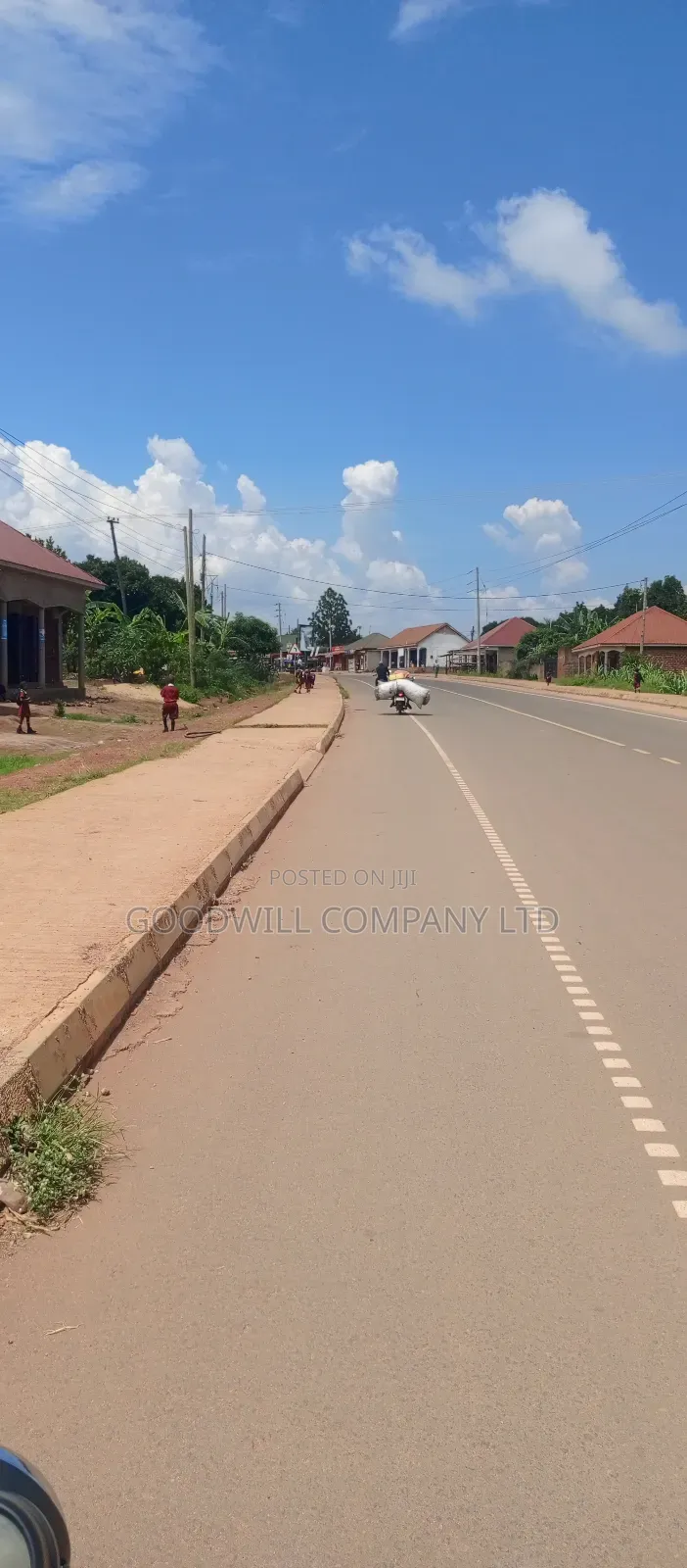 100*100 Feet / 25 Decimals of Land Bulega Garuga on Main Tarmac Road in Central Division