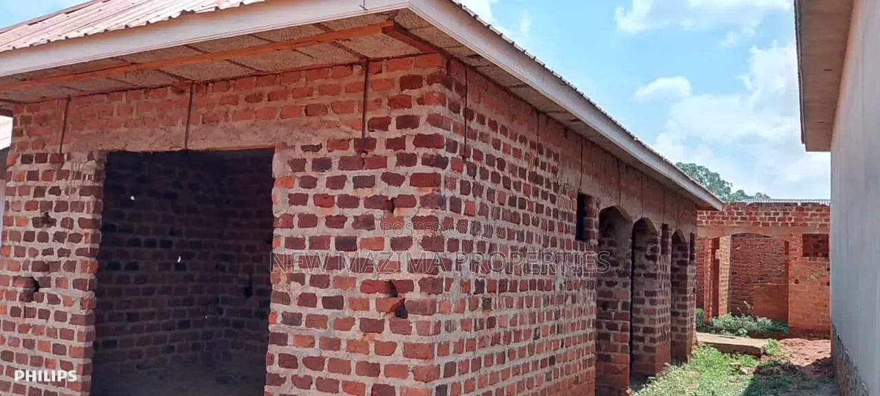 Three Semi Finished Rentals With Shop Forcedsale Heart of Nansana Town in Central Division
