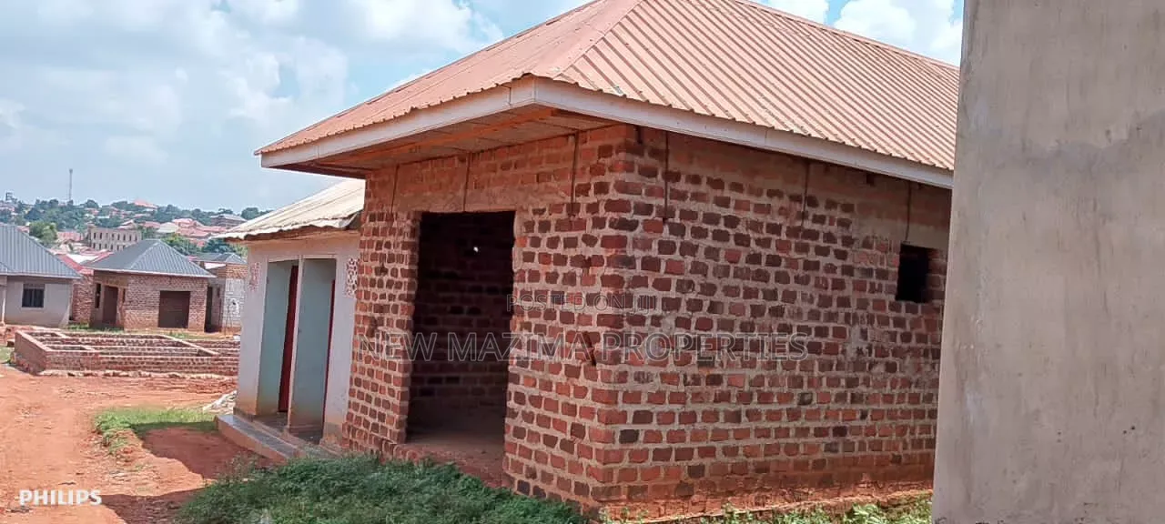 Three Semi Finished Rentals With Shop Forcedsale Heart of Nansana Town in Central Division