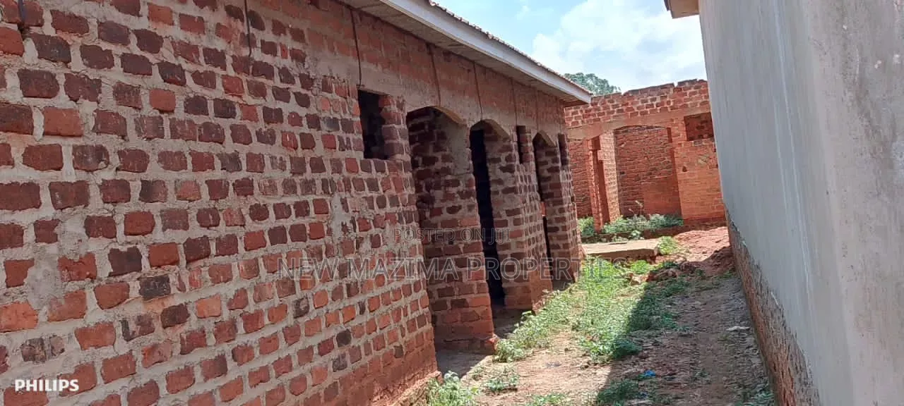 Three Semi Finished Rentals With Shop Forcedsale Heart of Nansana Town in Central Division