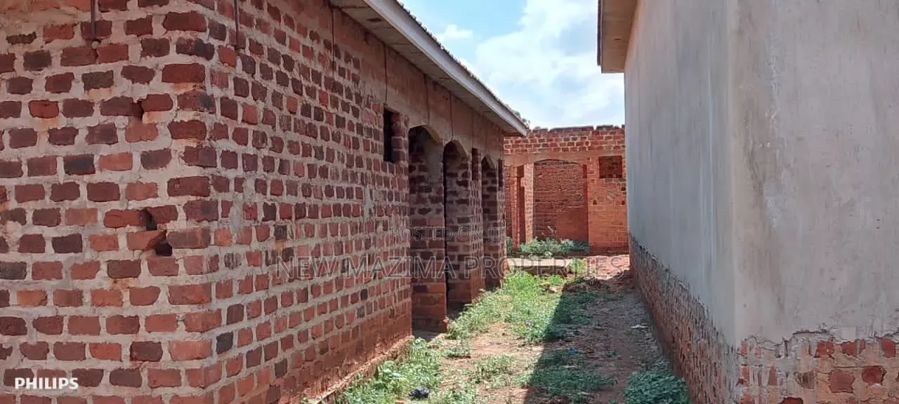 Three Semi Finished Rentals With Shop Forcedsale Heart of Nansana Town in Central Division