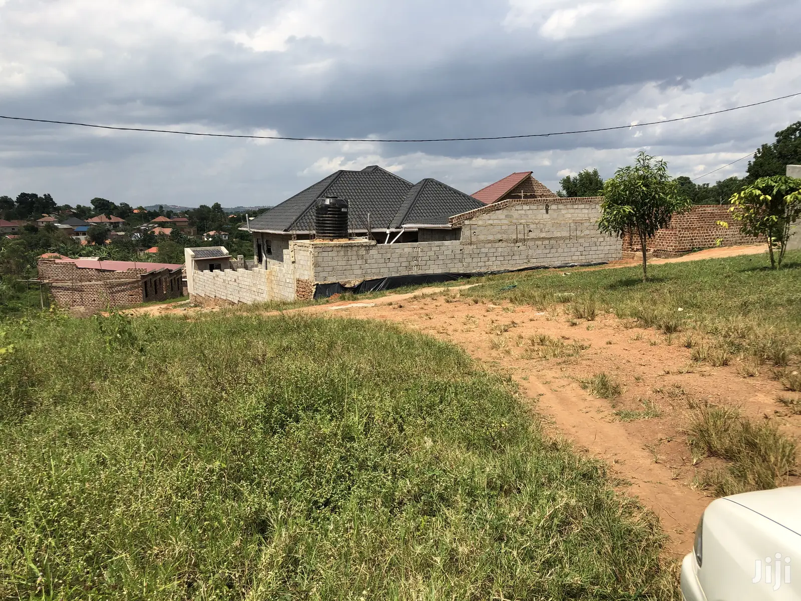 Kira Amazing Plot Near the Main Road on Sell in Kampala