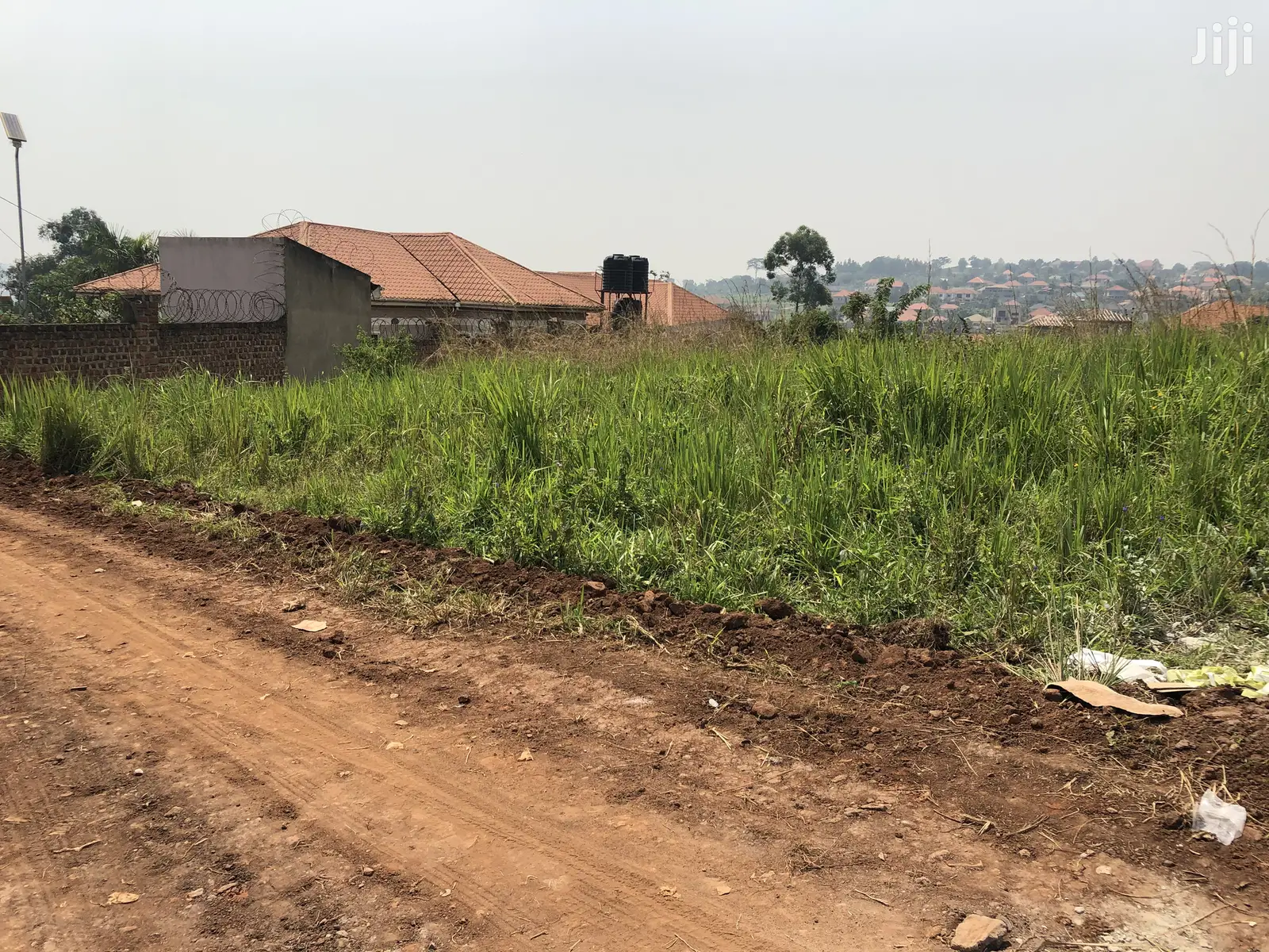 Kira Kimwani Twenty Five Decimals Near the Tarmack on Sell in Kampala