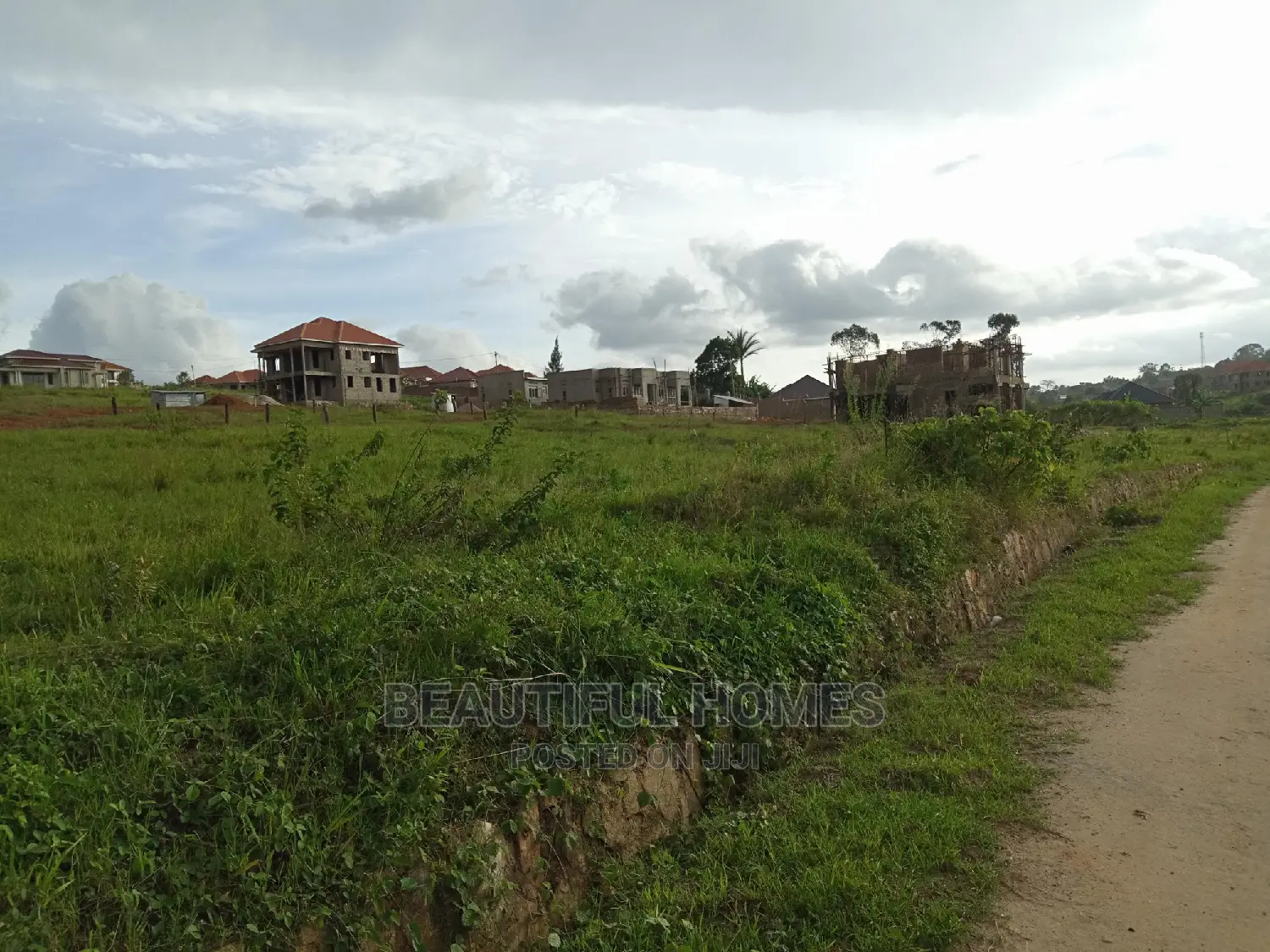 Kira Two Plots Close to the Main Road for Sale in Kampala